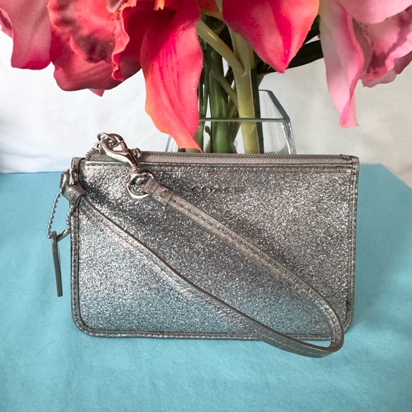 Coach Handbags - Coach EUC Ltd Ed silver glitter leather wristlet